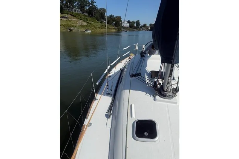 Slide: The Image of Sailing on a 2002 Beneteau First 36.7 yacht, calm river view. - 8