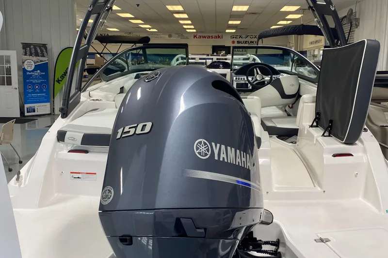 Slide: The Image of 2022 Regal 21 OBX boat with Yamaha 150 engine in showroom. - 4