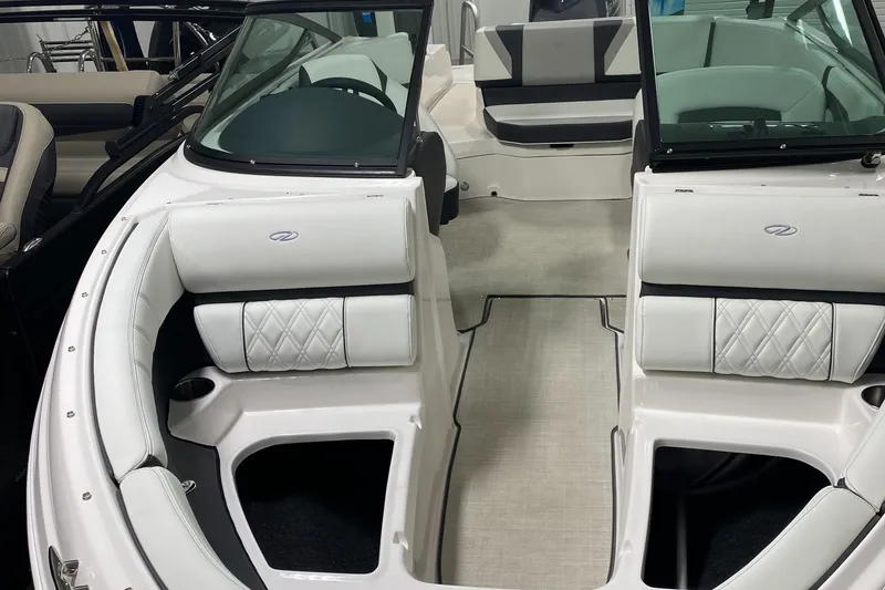 Slide: The Image of 2022 Regal 21 OBX boat interior with white seating and modern design. - 6