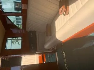 Slide: The Image of Interior of 2019 Hacker-Craft 35 Sea Limo Commuter with white seating and wooden accents. - 18