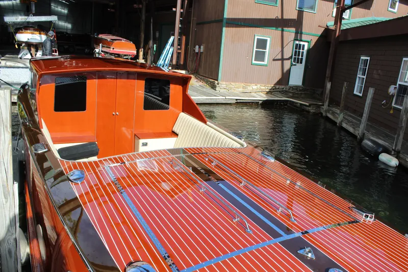 Slide: The Image of 2019 Hacker-Craft 35 Sea Limo Commuter boat docked in a marina. - 2
