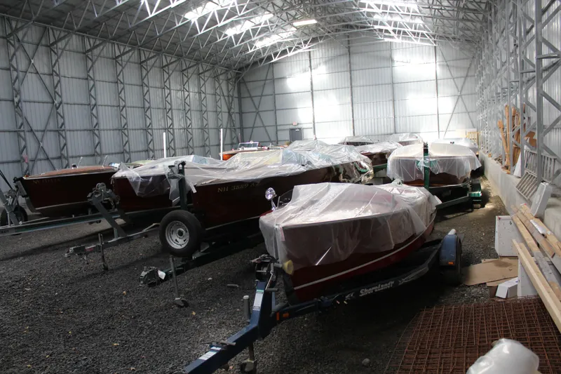 Slide: The Image of Covered 2019 Hacker-Craft 35 Sea Limo Commuter boats stored in a large warehouse. - 28
