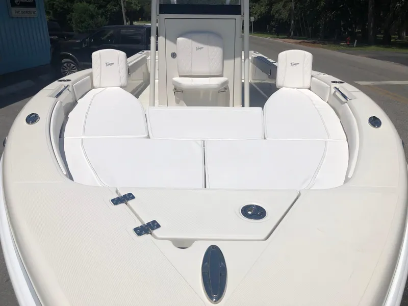 Slide: The Image of 2025 Ranger 2660 boat with white seating and sleek design. - 13