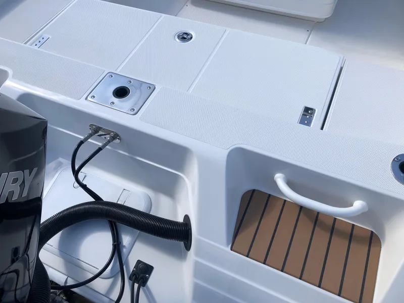 Slide: The Image of Ranger 2660 boat deck, 2025 model, featuring storage compartments and engine connections. - 17