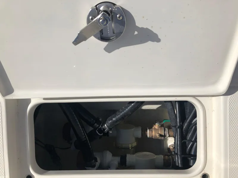 Slide: The Image of Ranger 2660 (2025) boat compartment with wiring and plumbing components. - 20
