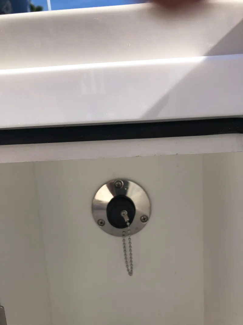 Slide: The Image of Ranger 2660 (2025) boat compartment with a secure lock and chain. - 23