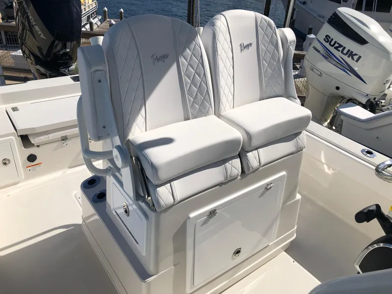 Slide: The Image of 2025 Ranger 2660 boat seats with white upholstery and diamond stitching. - 26
