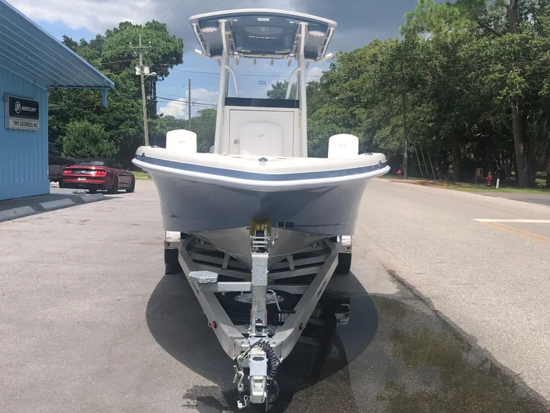 Slide: The Image of 2025 Ranger 2660 boat on trailer, parked on a sunny street. - 3
