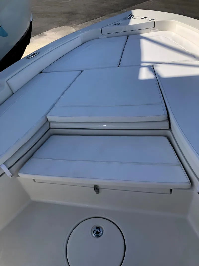 Slide: The Image of 2025 Ranger 2660 boat interior with cushioned seating and storage compartments. - 30
