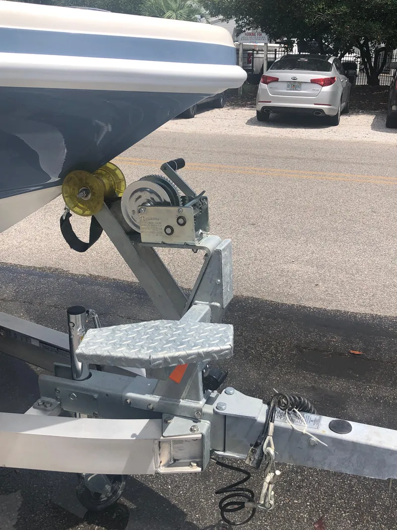 Slide: The Image of Ranger 2660 boat trailer hitch and winch, 2025 model, parked on asphalt. - 4