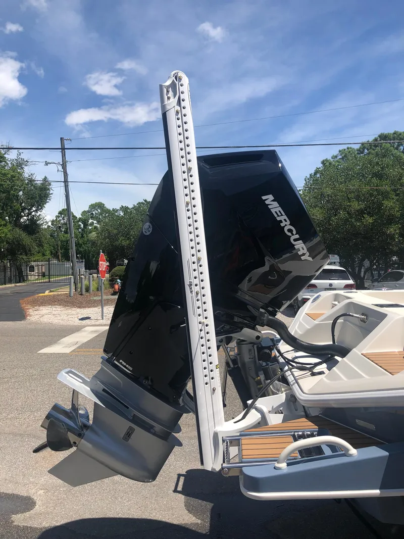 Slide: The Image of 2025 Ranger 2660 boat with Mercury outboard motor, parked outdoors. - 7