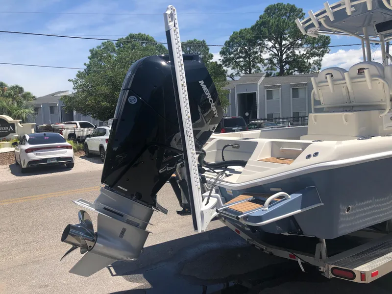 Slide: The Image of Ranger 2660 boat, 2025 model, with powerful outboard motor on trailer. - 8