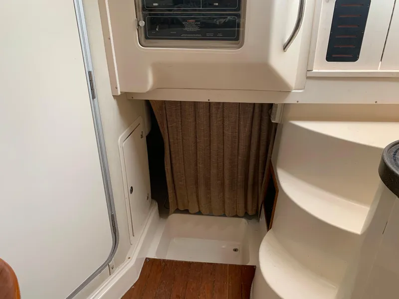 Slide: The Image of Interior of 2001 Grady-White 330 Express boat with stairs and curtain. - 11