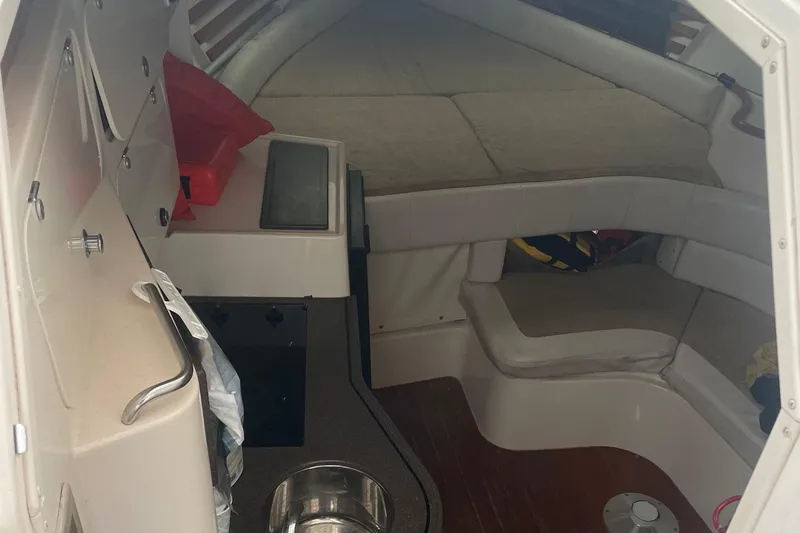 Slide: The Image of Interior cabin of a 2001 Grady-White 330 Express boat with seating and kitchenette. - 14