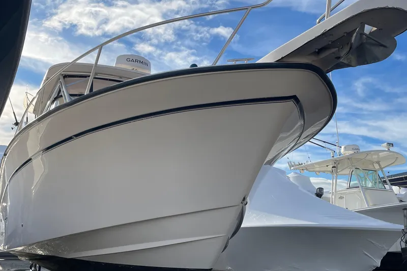 Slide: The Image of 2001 Grady-White 330 Express boat with Garmin equipment under a blue sky. - 17