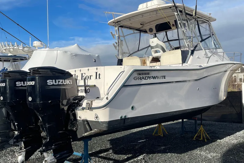 Slide: The Image of 2001 Grady-White 330 Express boat with twin Suzuki outboard motors. - 19