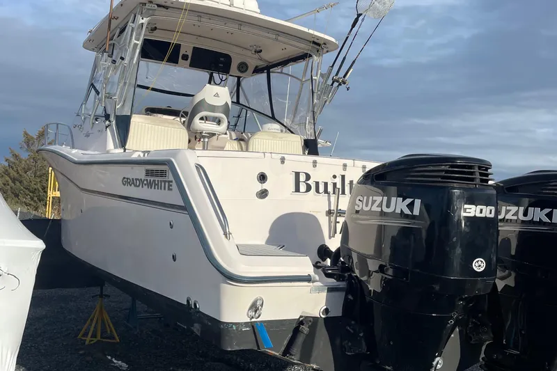 Slide: The Image of 2001 Grady-White 330 Express boat with twin Suzuki 300 outboard engines. - 20