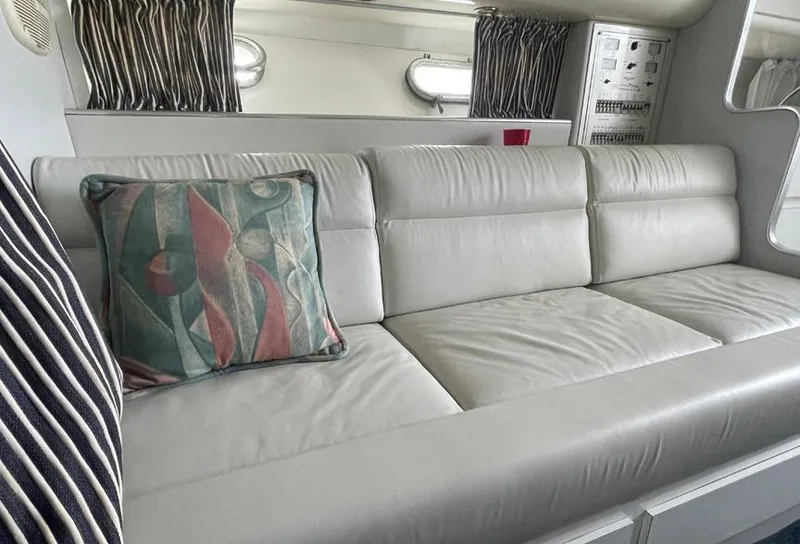 Slide: The Image of Luxurious interior of a 1999 Custom 42 model with a comfortable leather sofa. - 14