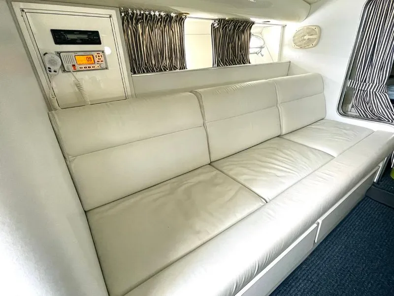 Slide: The Image of Luxurious white leather seating in a 1999 Custom 42 model interior. - 15