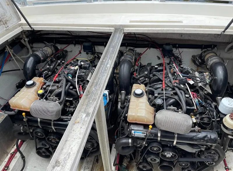 Slide: The Image of Twin engines in a 1999 Custom 42 boat, detailed view of engine compartment. - 17