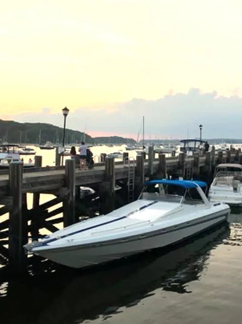 Slide: The Image of Custom 42 boat docked at sunset, 1999 model, serene marina view. - 6