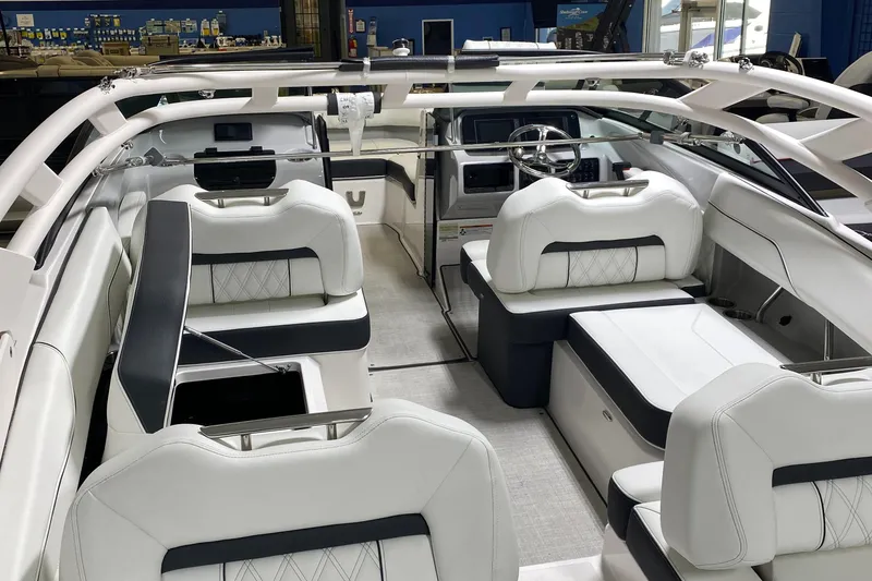 Slide: The Image of Luxurious interior of a 2022 Regal LX2 boat with white seating and modern design. - 2
