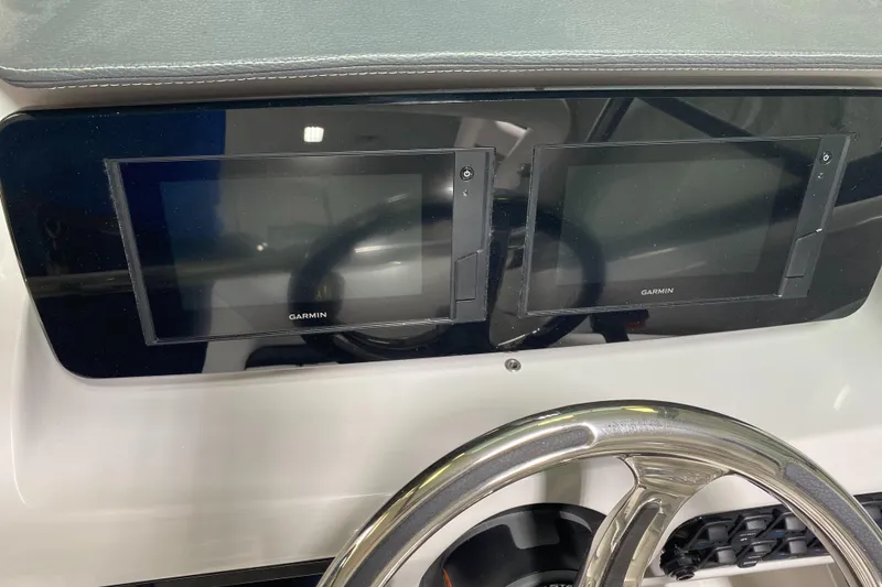 Slide: The Image of 2022 Regal LX2 dashboard with dual Garmin displays and steering wheel. - 3