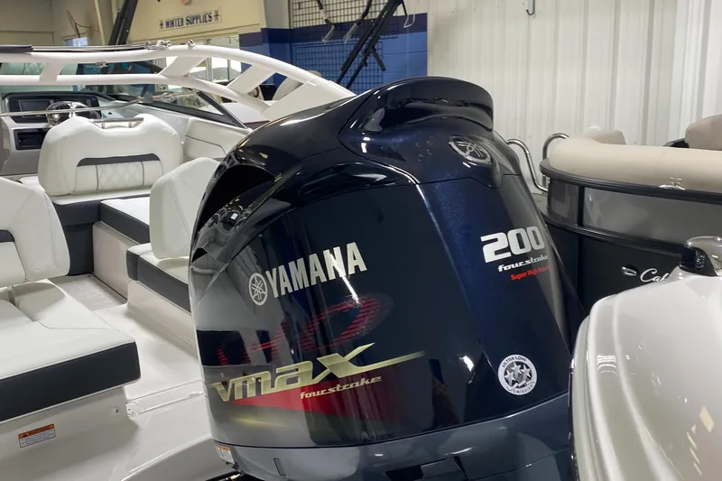 Slide: The Image of 2022 Regal LX2 boat with Yamaha VMAX 200 outboard motor in showroom. - 7
