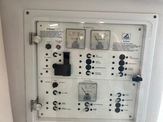 Slide: The Image of Control panel of a 2004 Pro-Line 30 WALK boat, featuring various switches and gauges. - 11