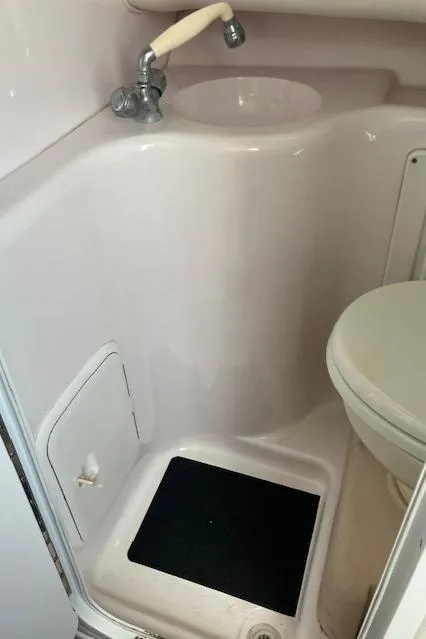 Slide: The Image of 2004 Pro-Line 30 WALK boat bathroom with sink and toilet. - 9