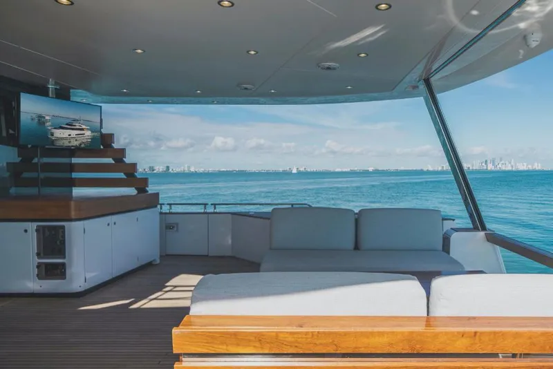 Slide: The Image of Azimut Magellano 25 Metri 2023 yacht deck with ocean view and modern seating. - 15