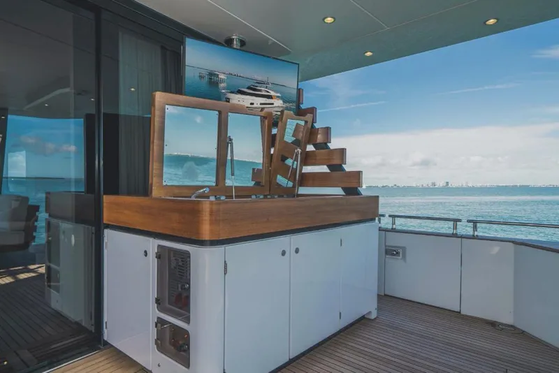 Slide: The Image of Azimut Magellano 25 Metri 2023 yacht deck with outdoor kitchen and ocean view. - 19