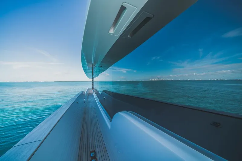 Slide: The Image of Azimut Magellano 25 Metri 2023 yacht reflecting on calm ocean waters. - 25