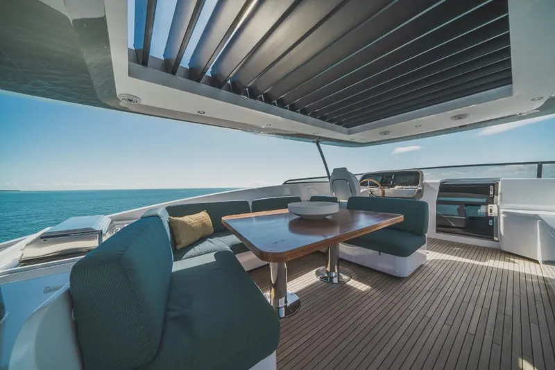 Slide: The Image of Azimut Magellano 25 Metri 2023 yacht with luxurious outdoor seating and ocean view. - 38