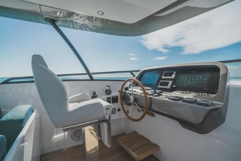 Slide: The Image of 2023 Azimut Magellano 25 Metri yacht helm station with modern controls and panoramic view. - 43