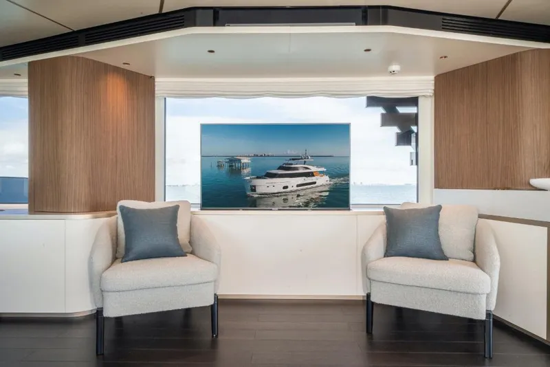 Slide: The Image of Modern interior of Azimut Magellano 25 Metri yacht, 2023, with two armchairs and sea view. - 49
