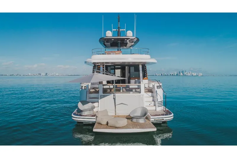 Slide: The Image of 2023 Azimut Magellano 25 Metri luxury yacht on calm waters with city skyline. - 6