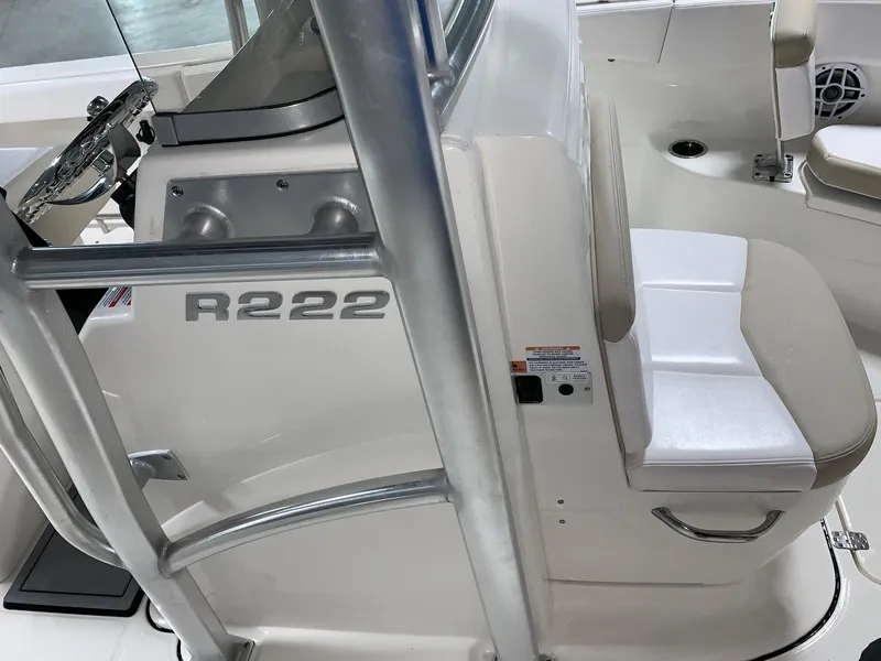 Slide: The Image of 2026 Robalo R222 Center Console interior with seating and console details. - 20