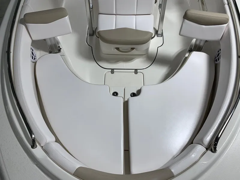 Slide: The Image of 2026 Robalo R222 Center Console boat interior with cushioned seating. - 7