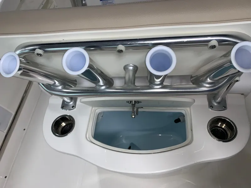 Slide: The Image of 2026 Robalo R222 Center Console fishing rod holders and livewell. - 9