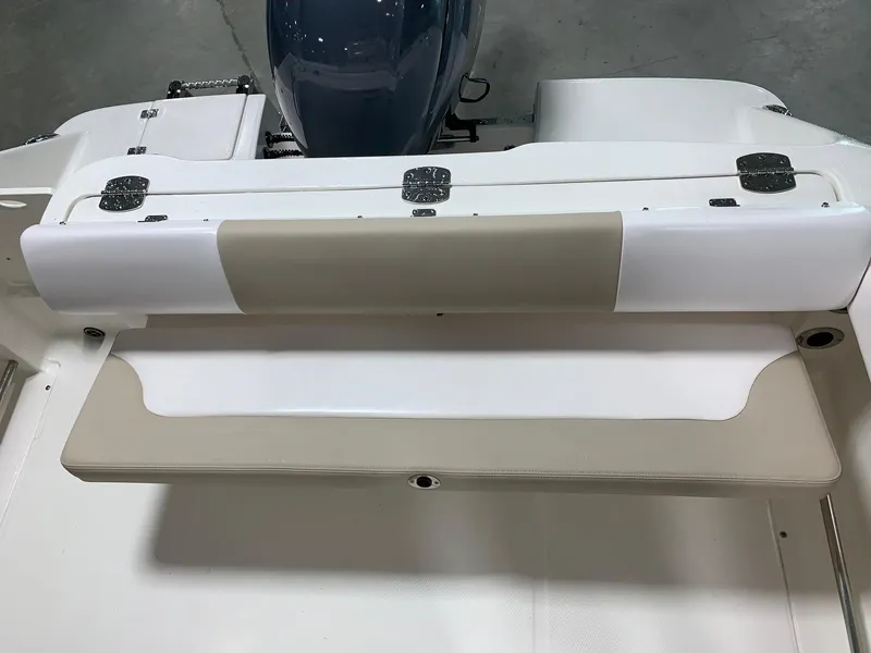Slide: The Image of 2026 Robalo R222 Center Console boat seat, beige and white upholstery, rear view. - 11