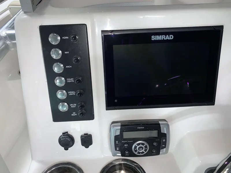 Slide: The Image of 2026 Robalo R222 Center Console dashboard with Simrad display and control panel. - 14