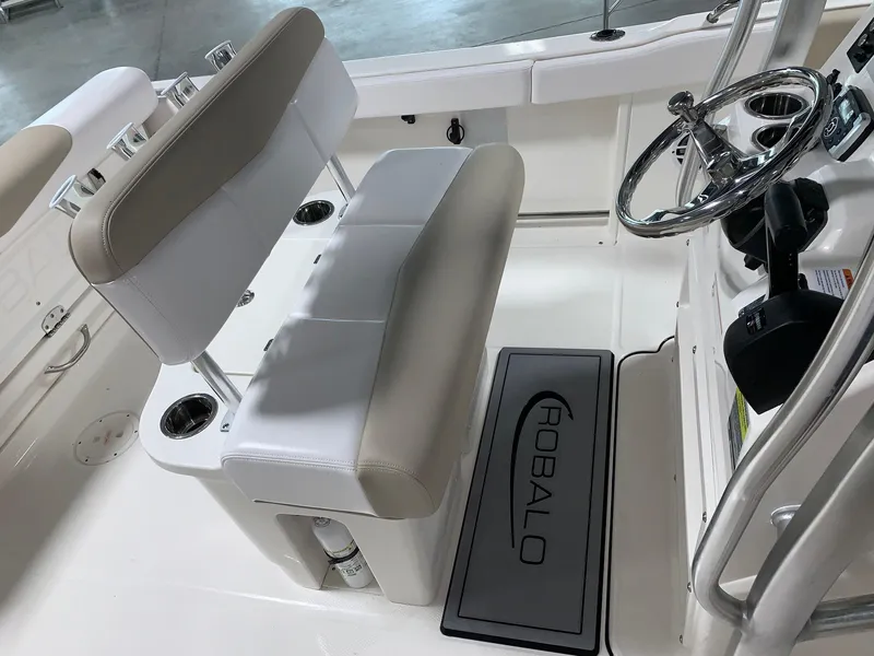 Slide: The Image of 2026 Robalo R222 Center Console interior with steering wheel and seating. - 17