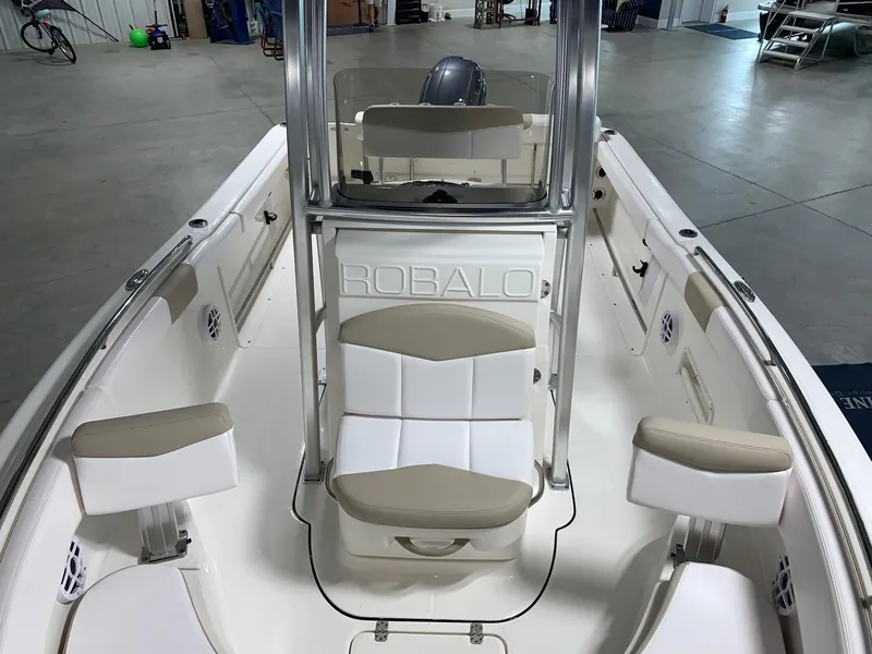 Slide: The Image of 2026 Robalo R222 Center Console boat interior with seating and console view. - 7