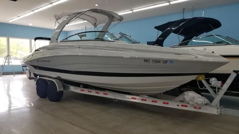 Slide: The Image of 2018 Crownline 275 SS boat on trailer in showroom. - 3