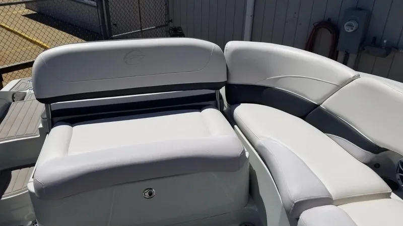 Slide: The Image of 2018 Crownline 275 SS boat interior with white cushioned seating. - 5
