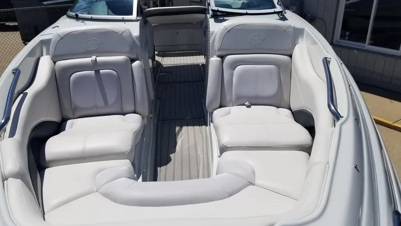 Slide: The Image of 2018 Crownline 275 SS boat interior with white leather seating and sleek design. - 6