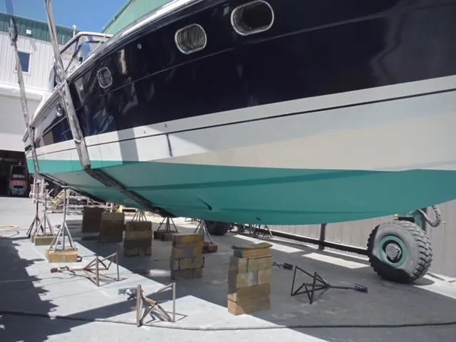 Slide: The Image of 1997 Baia Cantieri boat on blocks in a shipyard for maintenance. - 16