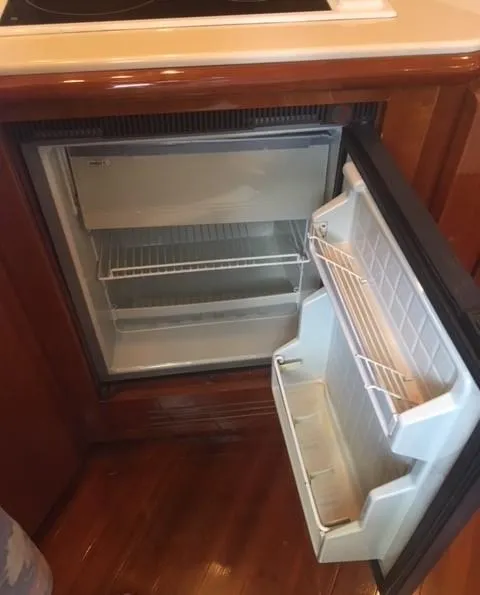 Slide: The Image of Open mini fridge in 1997 Baia Cantieri boat interior. - 7