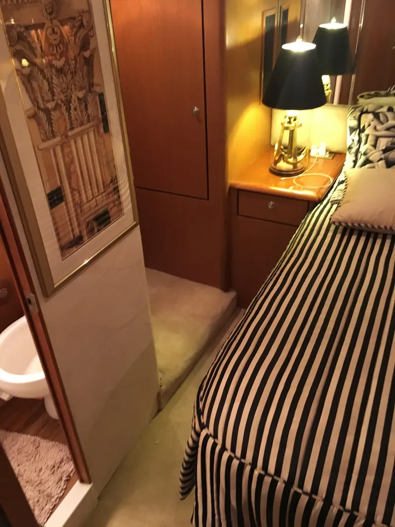 Slide: The Image of Luxurious cabin interior of 2001 Ocean Yachts 56 Super Sport with striped bedding. - 29